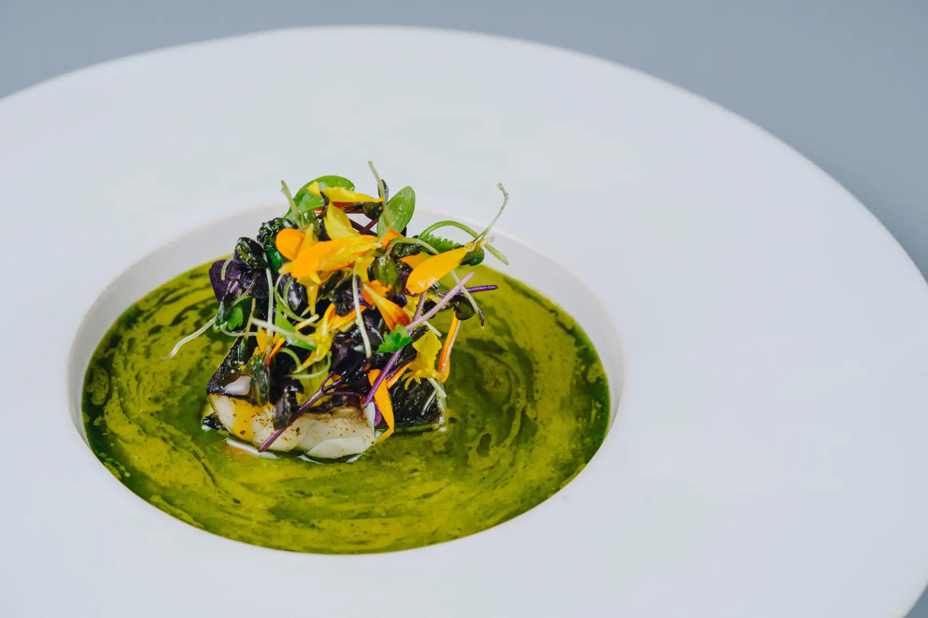 Lomo de tilapia en ceviche caliente
